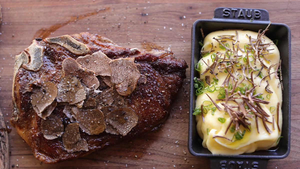 Shaved truffle over a steak and potato puree